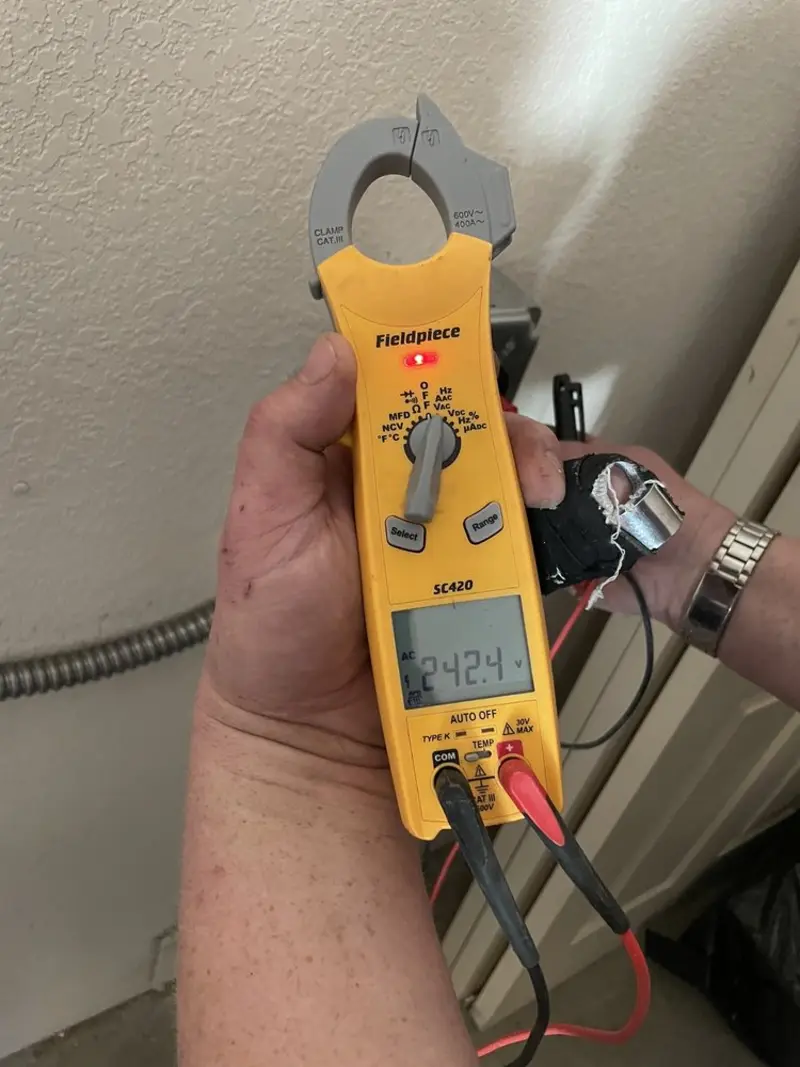 Voltage testing with clamp meter during Circuit Breaker Repair in Oxford